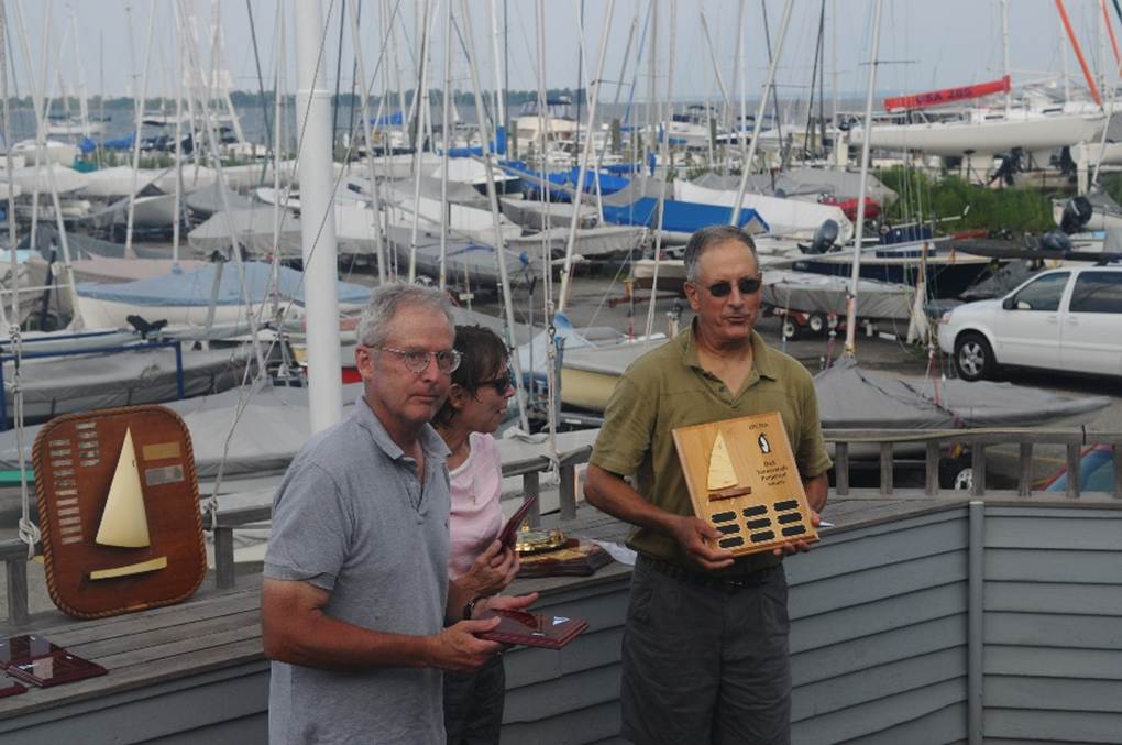 A group of people standing on a dock
AI-generated content may be incorrect.