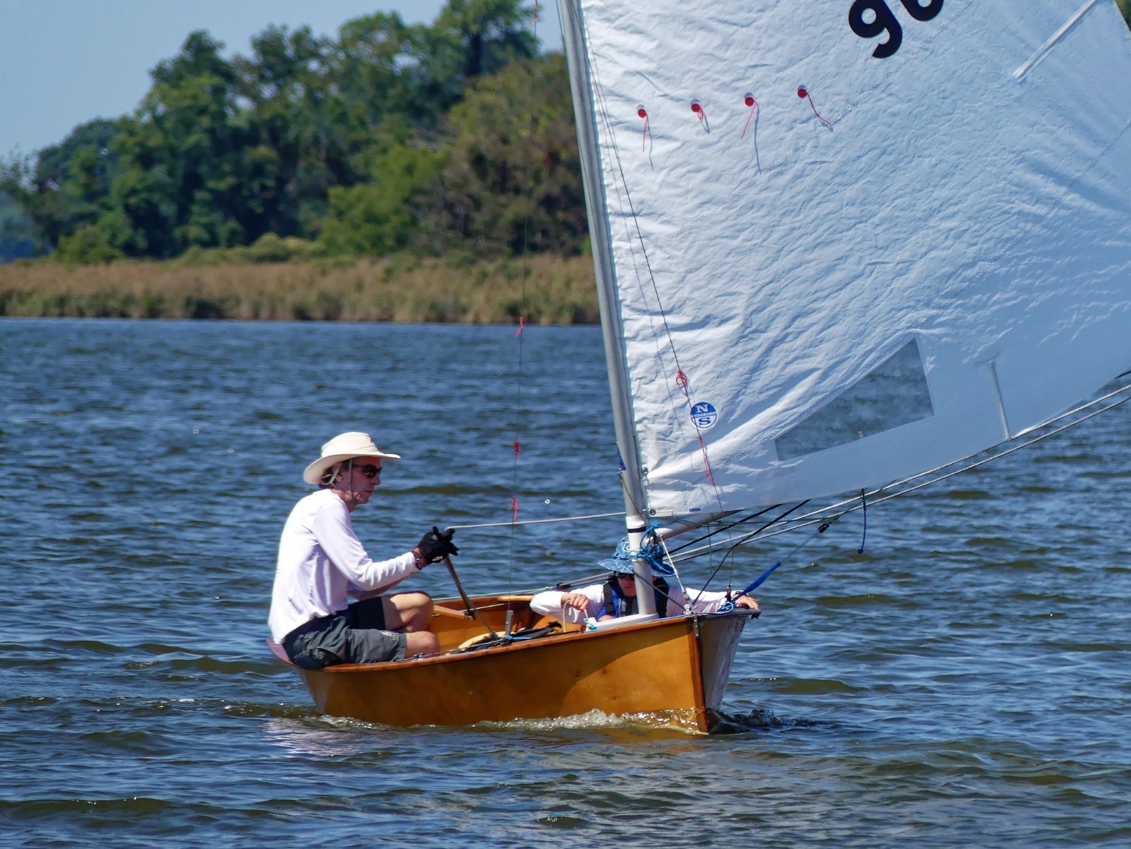 A person in a boat on the water AI-generated content may be incorrect.