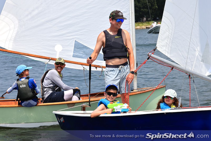 Families aboard Penguins between races, water gun at the ready