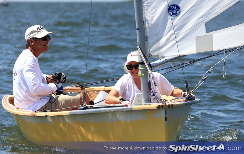 Crew of a yellow Penguin enjoying the racing